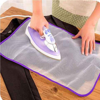 Ironing protector mesh cloth over a dark garment
