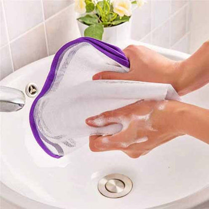 Purple trimmed ironing mesh cloth being hand washed